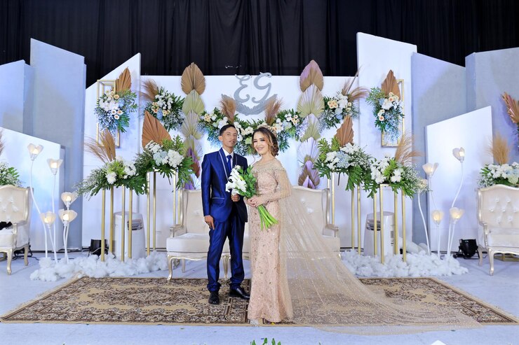 couple-marriage-with-wedding-backdrop-flower-wedding-decoration_1048944-21285620